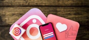 instagram-interface-with-mobile-phone-on-wooden-table_23-2147841376