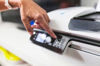 crop-hand-pushing-buttons-printer_23-2147779003