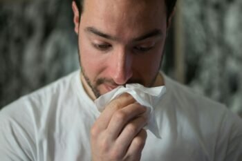 Photo by Brittany Colette | ILikeGuru man wiping mouse with tissue paper