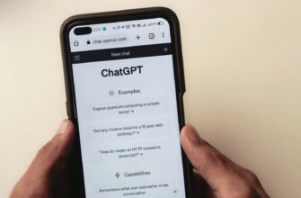 Webpage of ChatGPT, a prototype AI chatbot, is seen on the website of OpenAI, on a smartphone. Examples, capabilities, and limitations are shown.